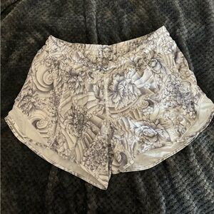 White and grey floral lulu shorts. Size 10